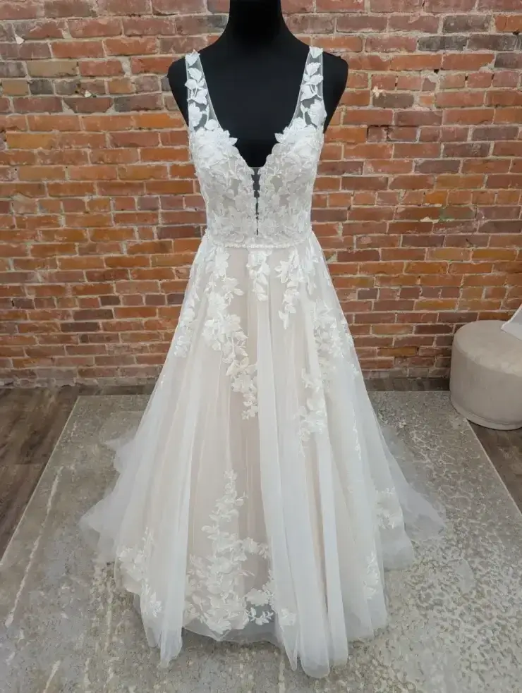 image shows a sleeveless a-line wedding dress