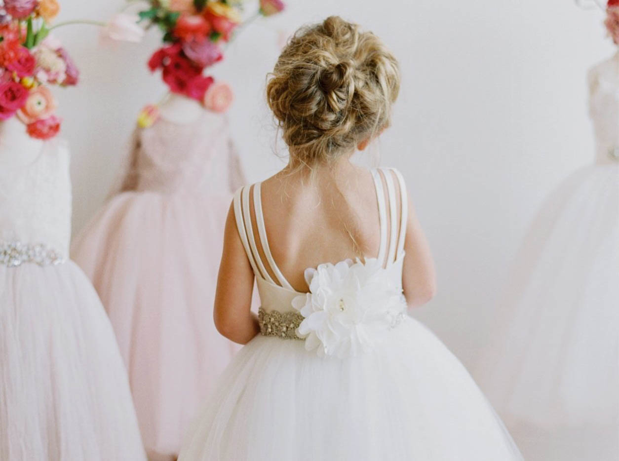 Young model wearing a white gown